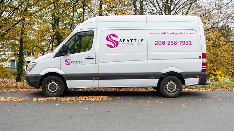 White van marked with "Smithfield," indicating a flooring service based in Seattle, WA.