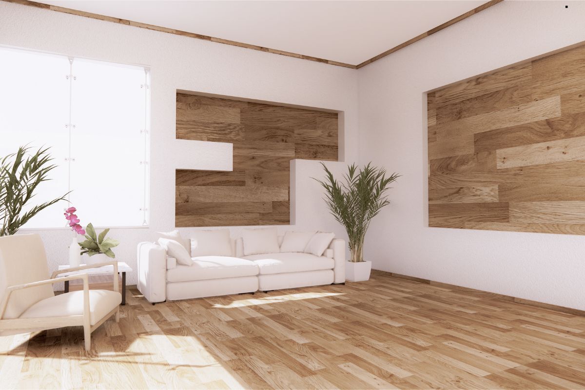 A stylish living room featuring wooden floors and elegant white furniture, showcasing a modern and inviting atmosphere.
